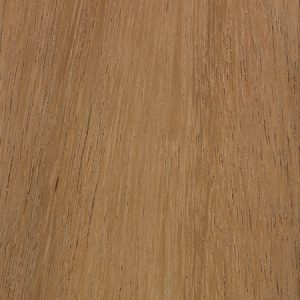 Close-up of warm brown wood grain with visible vertical streaks and a smooth finish.